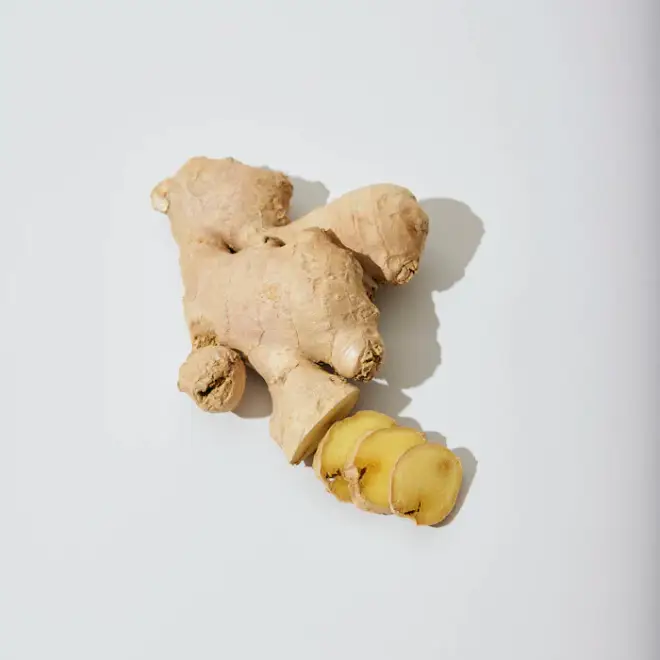 Fresh ginger root with slices